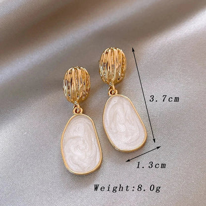 Boucles Ovales™ | Élégance en émail vintage
