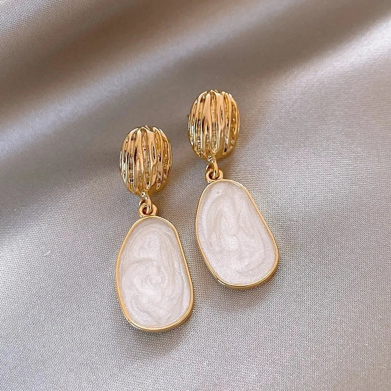 Boucles Ovales™ | Élégance en émail vintage